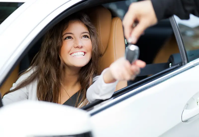 smiling girl in new car